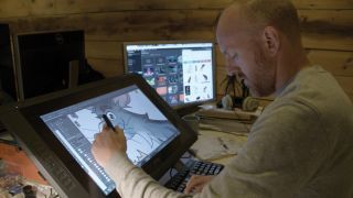 Művész dolgozik egy rajz tabletta