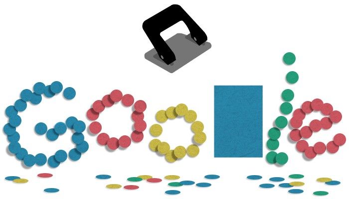 Una perforadora y un garabato de Google compuesto por un colorido corte circular de papel